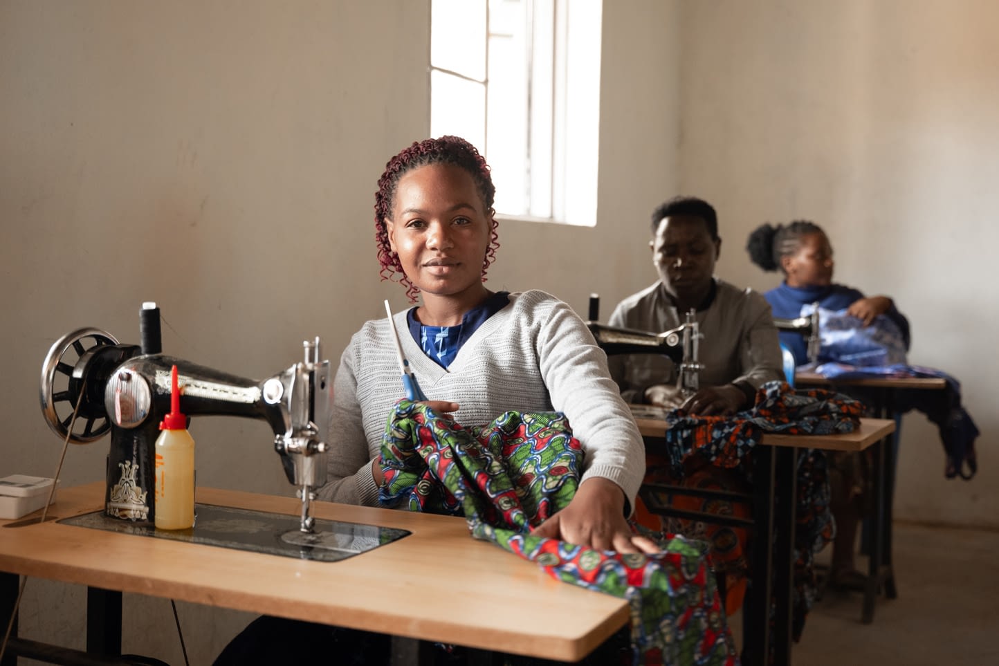 Bwindi Eco Vocational School student using a sewing machine